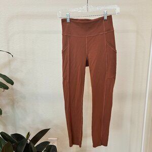 LULULEMON WUNDER UNDER ORANGE LEGGINGS WITH POCKET SIZE 4 ONLY WORN A FEW TIMES